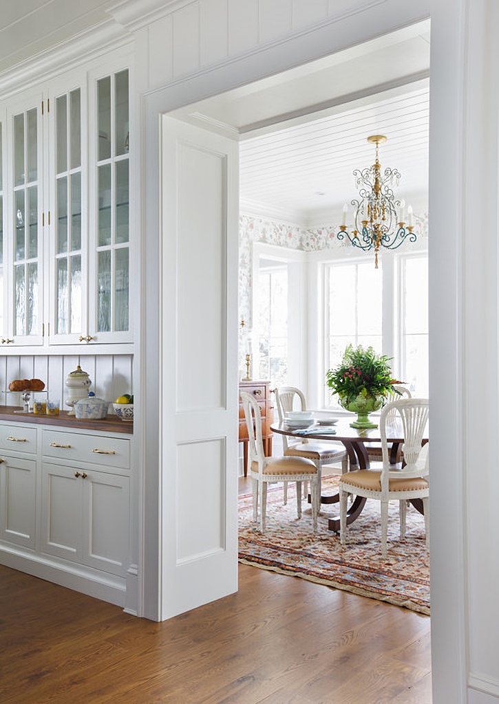 white traditional dining room with built-ins