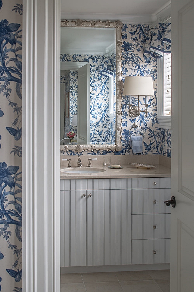 blue and white traditional bathroom with wallpaper