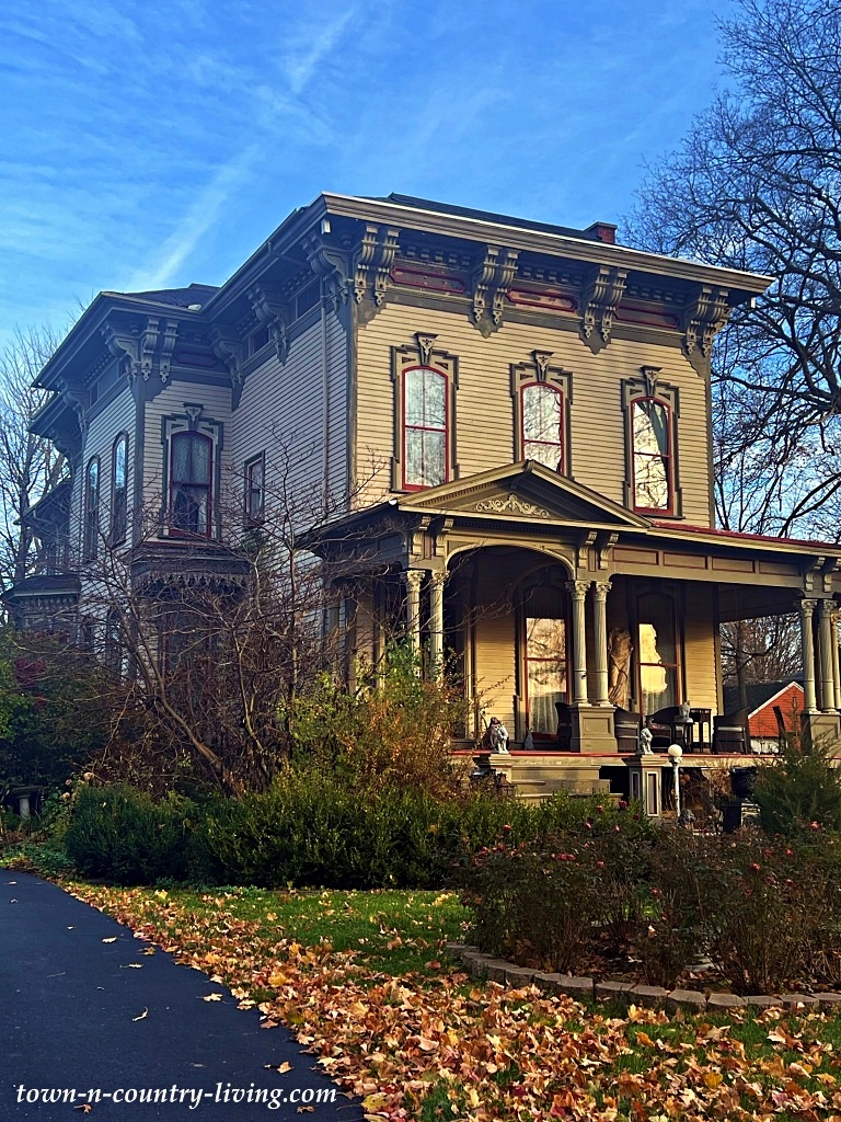 large brown Victorian home in a small town