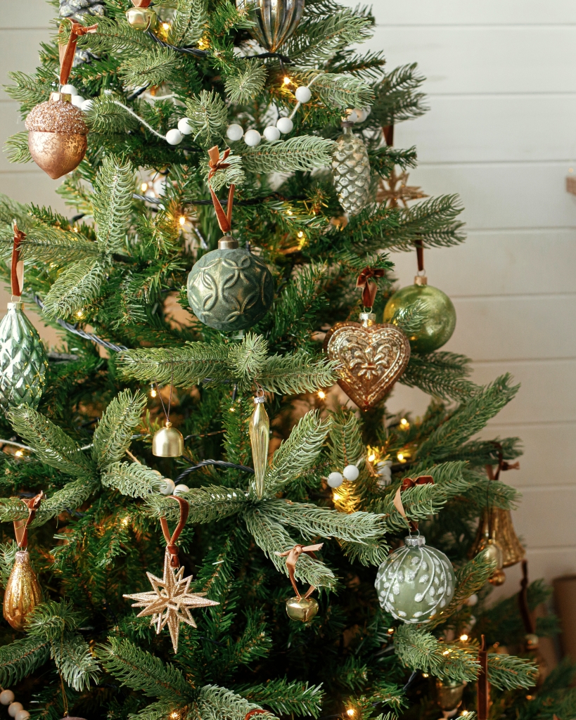 Vintage green and gold ornaments - decorating a Christmas tree