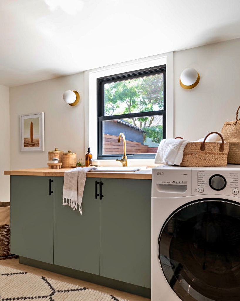 laundry room with gray green cabinets