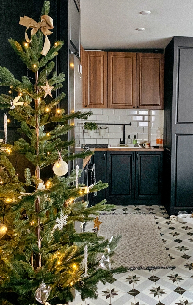 sparse Christmas tree in a kitchen