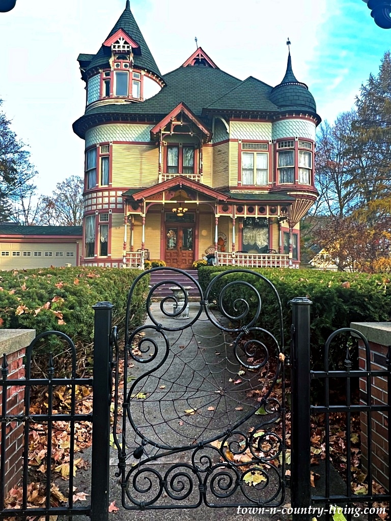 Extremely large Victorian home with iron gate