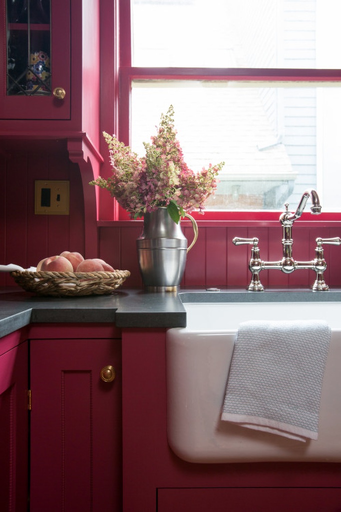 farmhouse sink in red kitchen