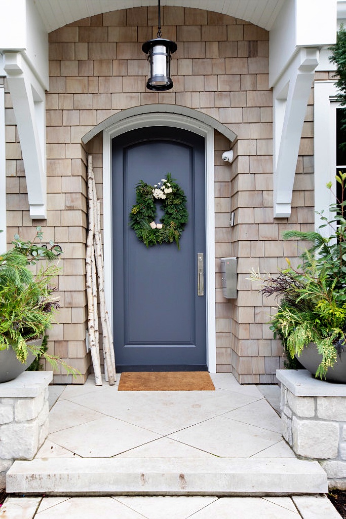 Arched blue door with arched portico