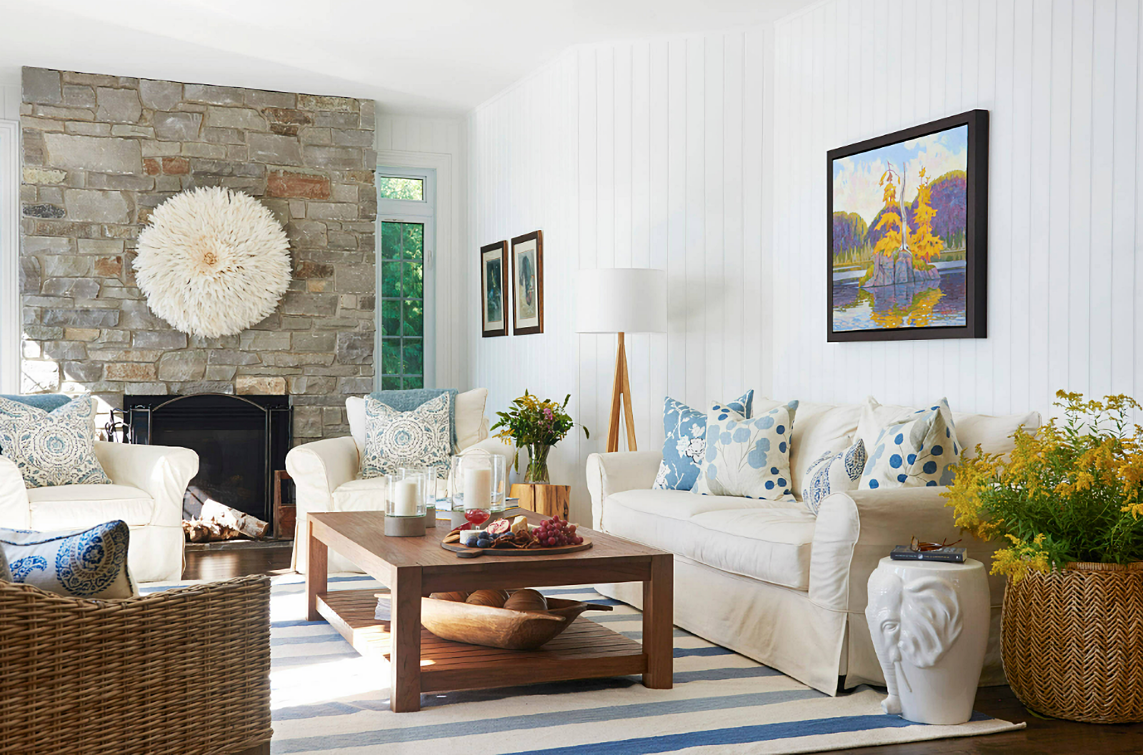 blue and white coastal living room with stone fireplace