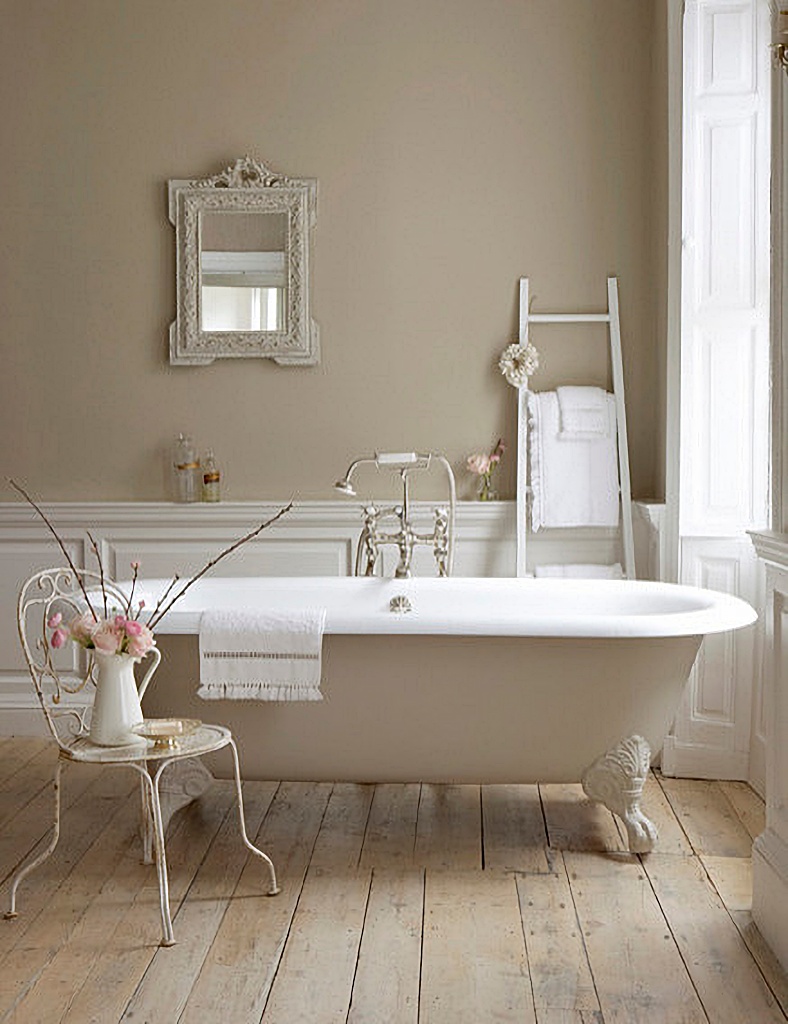 Beige and white bathroom with claw foot tub