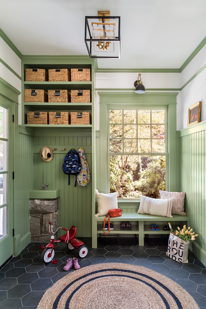 Colonial style mudroom with bead board siding in pale green