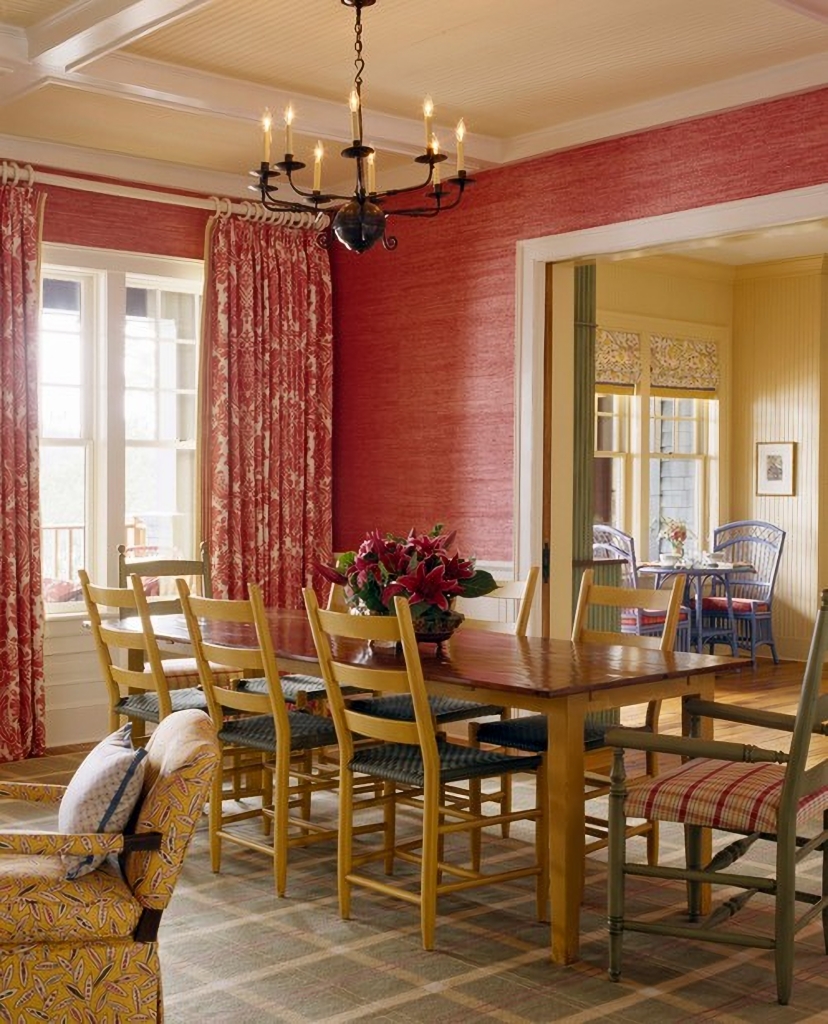 red dining room with yellow chairs
