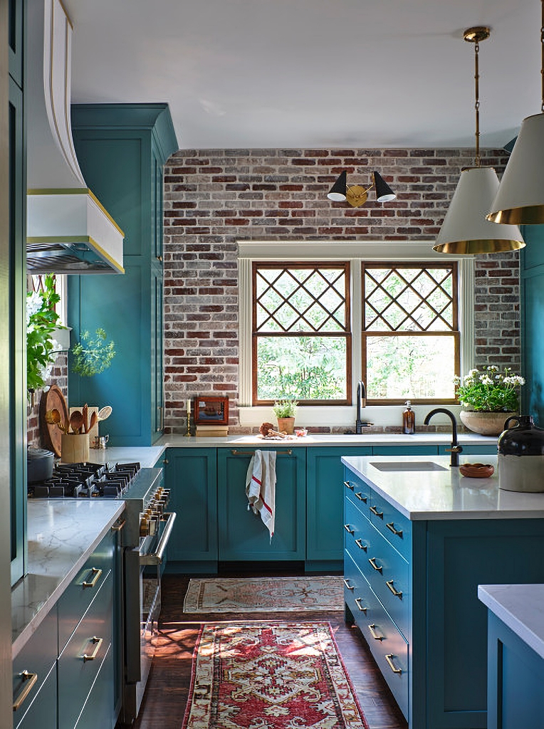 custom kitchen with turquoise cabinets and brick walls