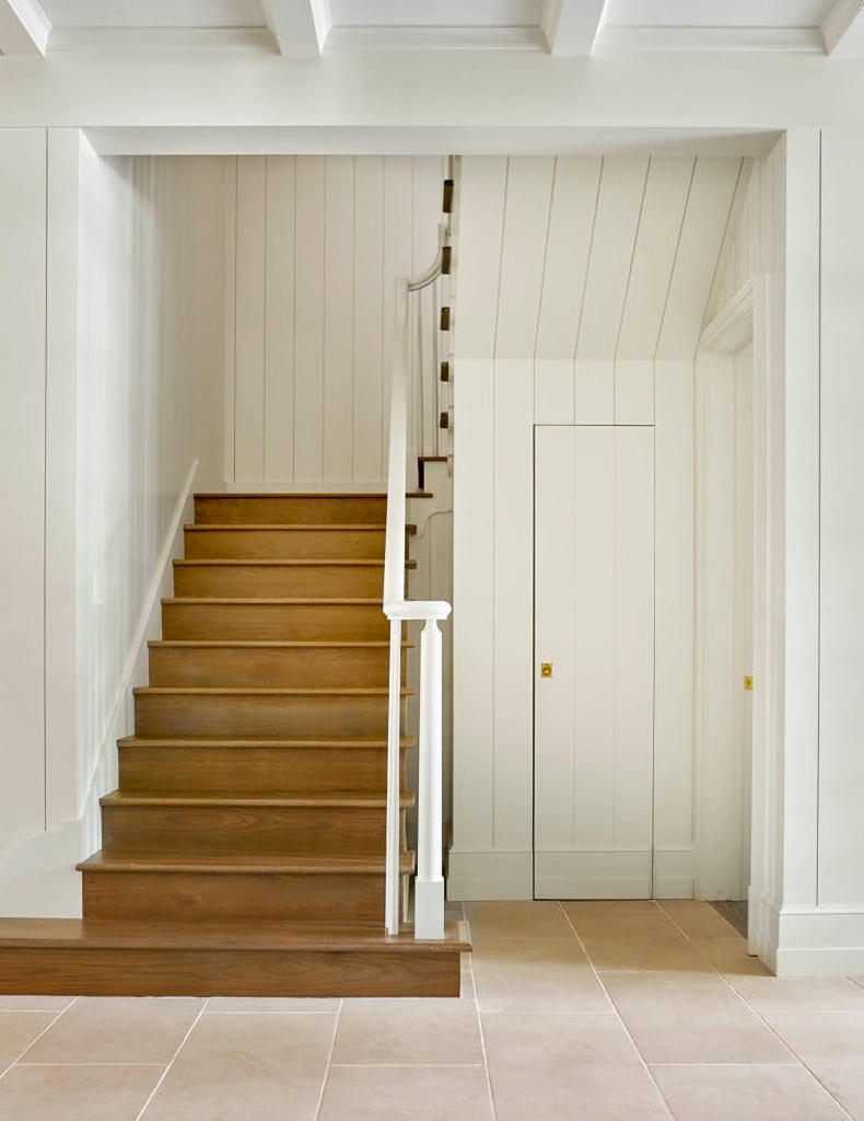 traditional staircase in wood and white