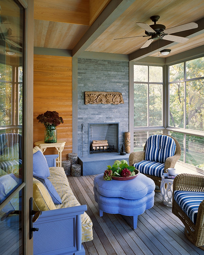 screened-in porch with fireplace and living room style furniture