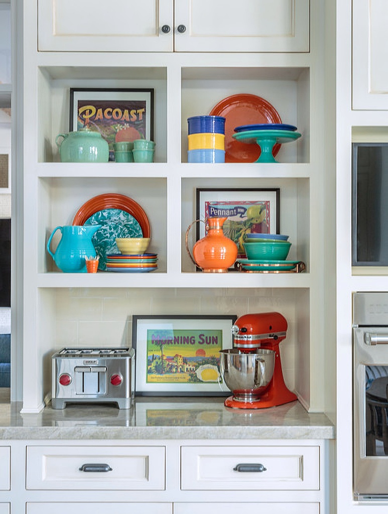 colorful Bauer pottery on kitchen shelves