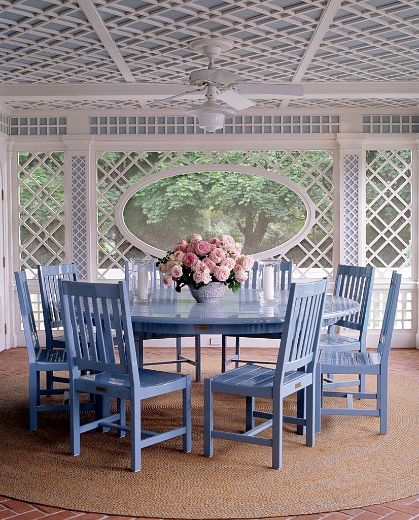 fancy three season porch with dining table