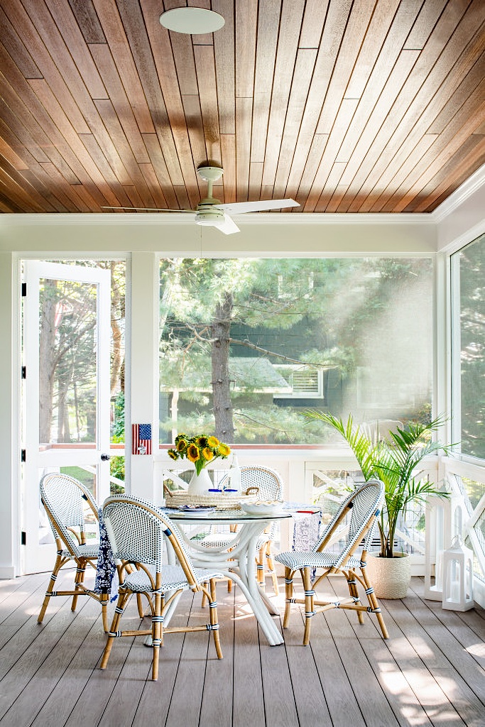 screened in porch on dark green cottage