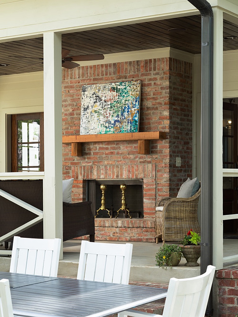 outdoor fireplace on back porch