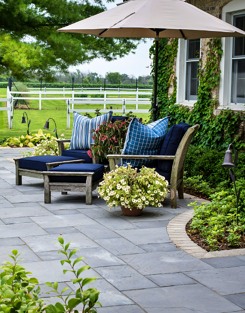 paver patio in front of historic stone house