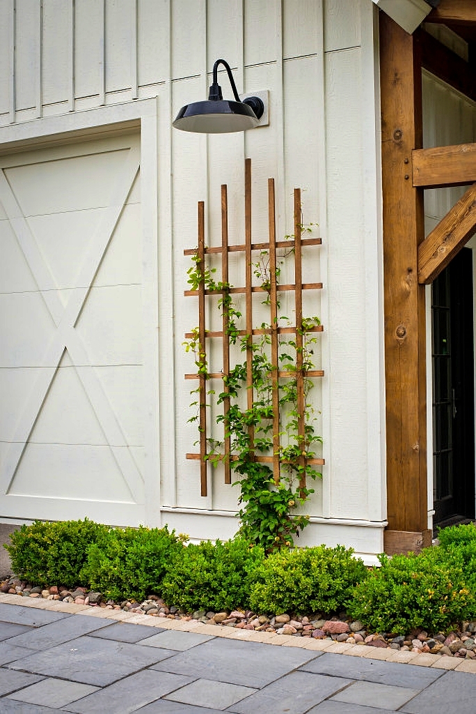 wooden trellis on side of farmhouse