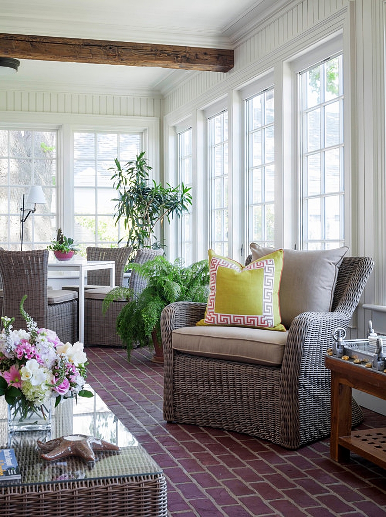 sunroom with gray wicker chairs