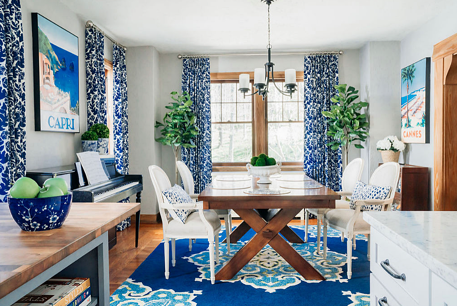 blue and white dining room with fireplace and piano