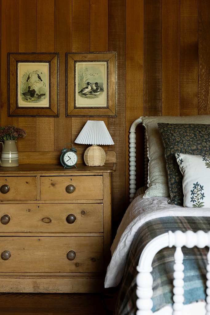 White Jenny Lind bed in rustic bedroom