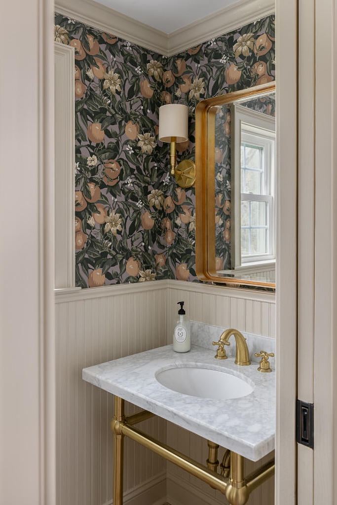 wallpapered traditional powder room