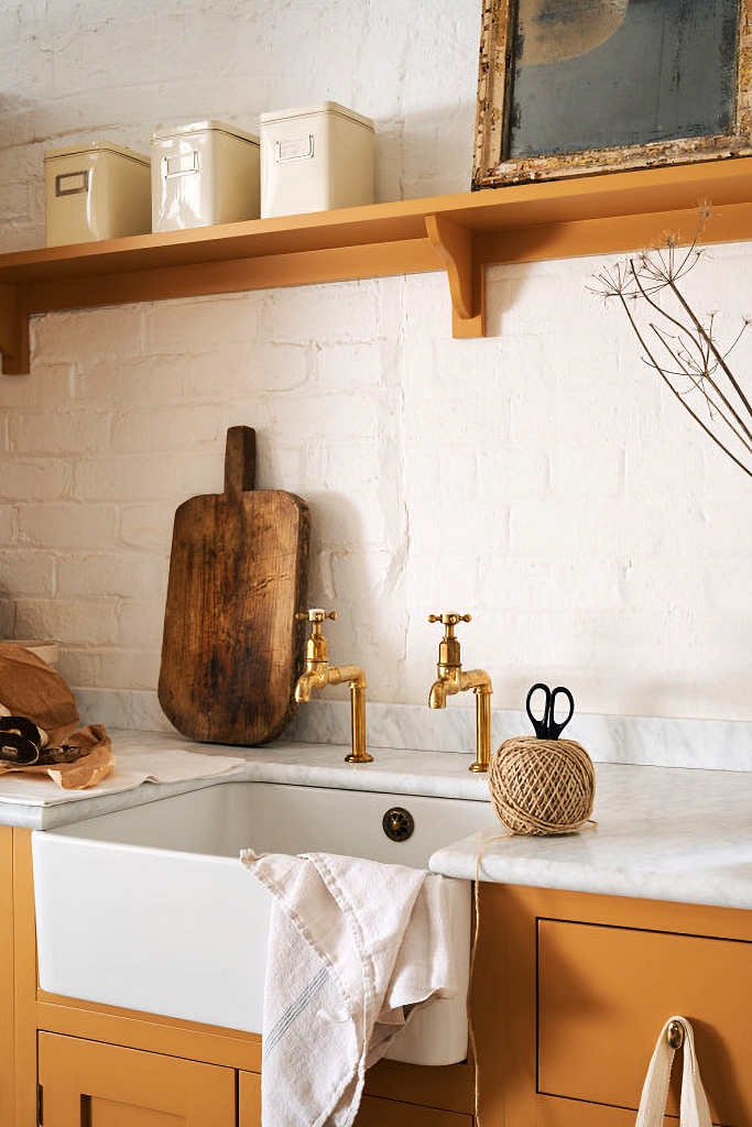 apron kitchen sink with antique brass faucets