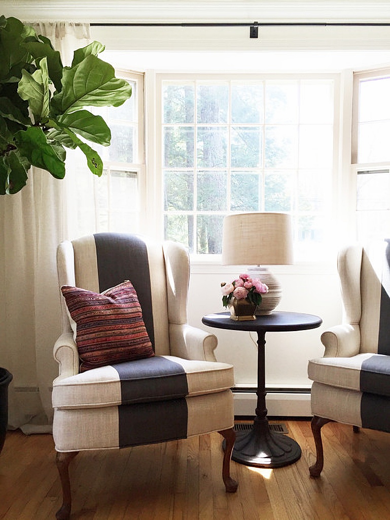 striped wing chairs in dining room