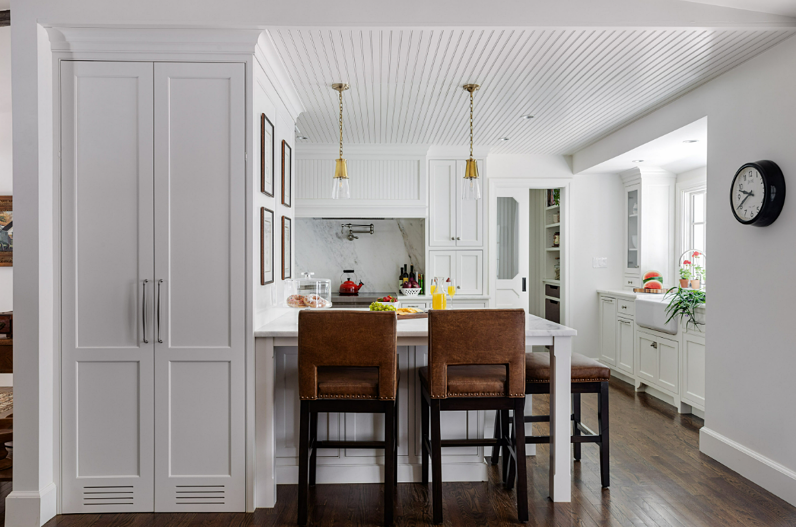 white traditional kitchen with marble counter tops