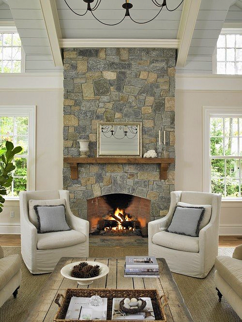 neutral living room with stone fireplace