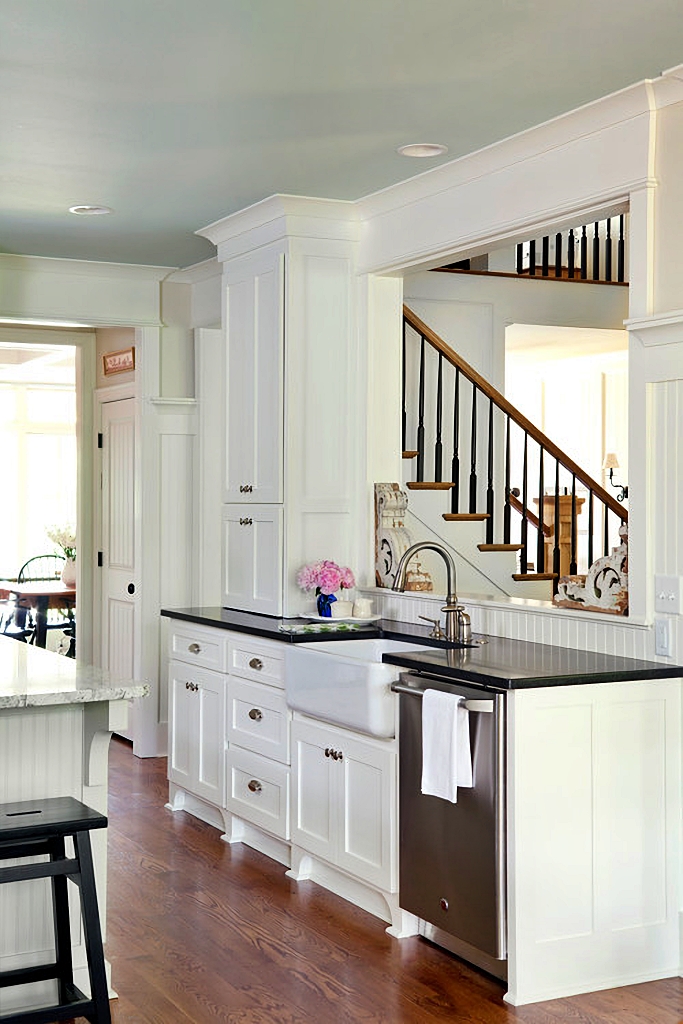 white kitchen with window to family room