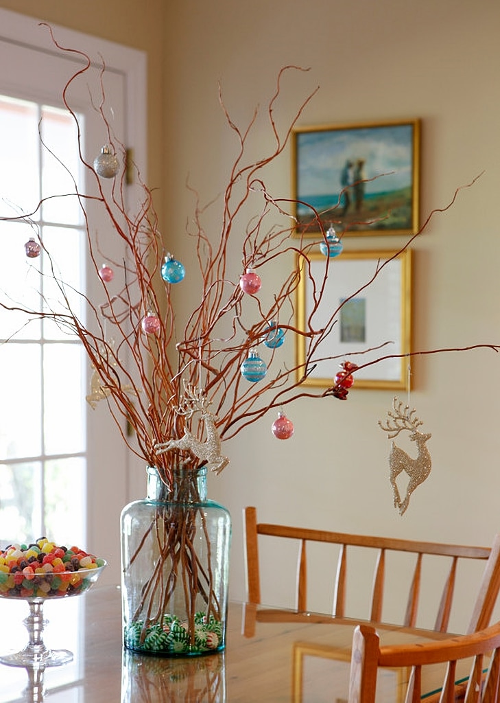 bare branches with small ornaments for Christmas