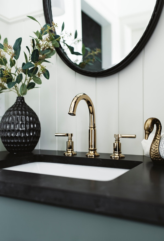 brass faucet fixtures in traditional bathroom