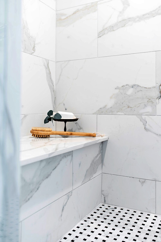 marble walled walk-in shower