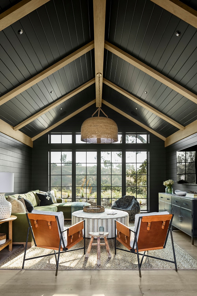 dark living room with vaulted ceiling