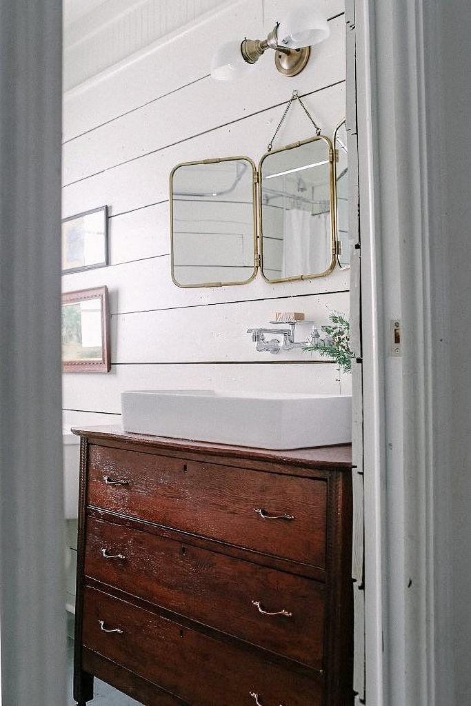 vintage bathroom makeover with wood furniture