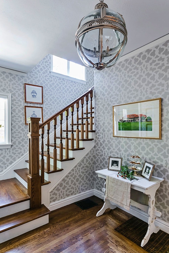 light gray and white geometric wallpaper in entryway