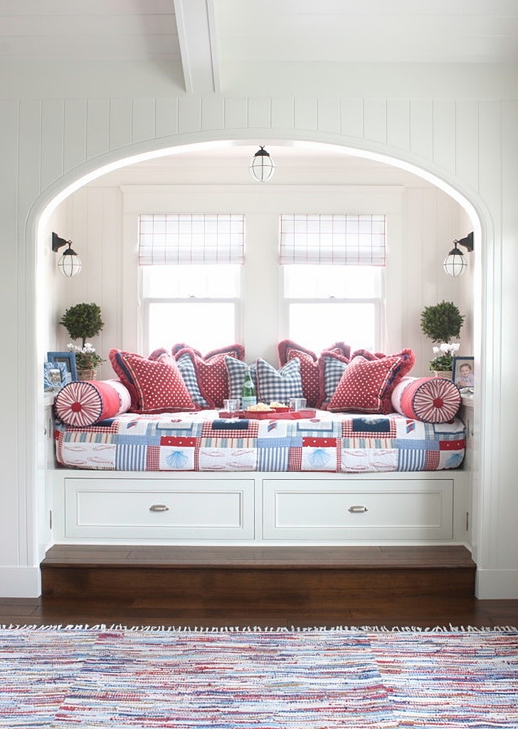 alcove window seat with patterned pillows