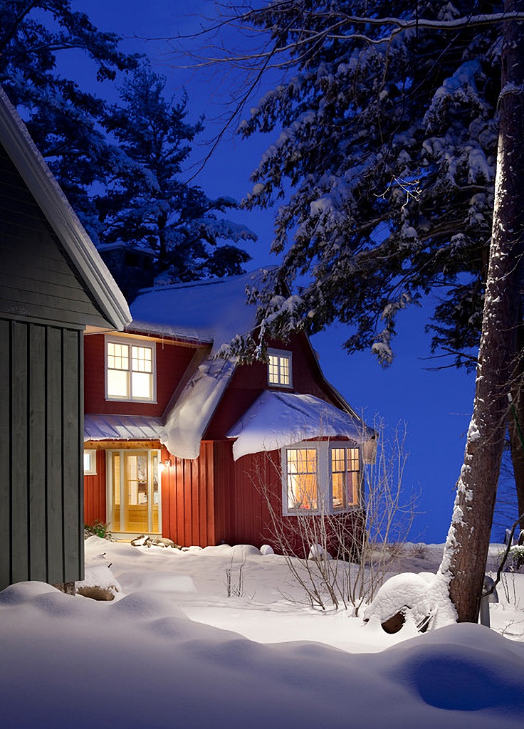 red cottage in snow