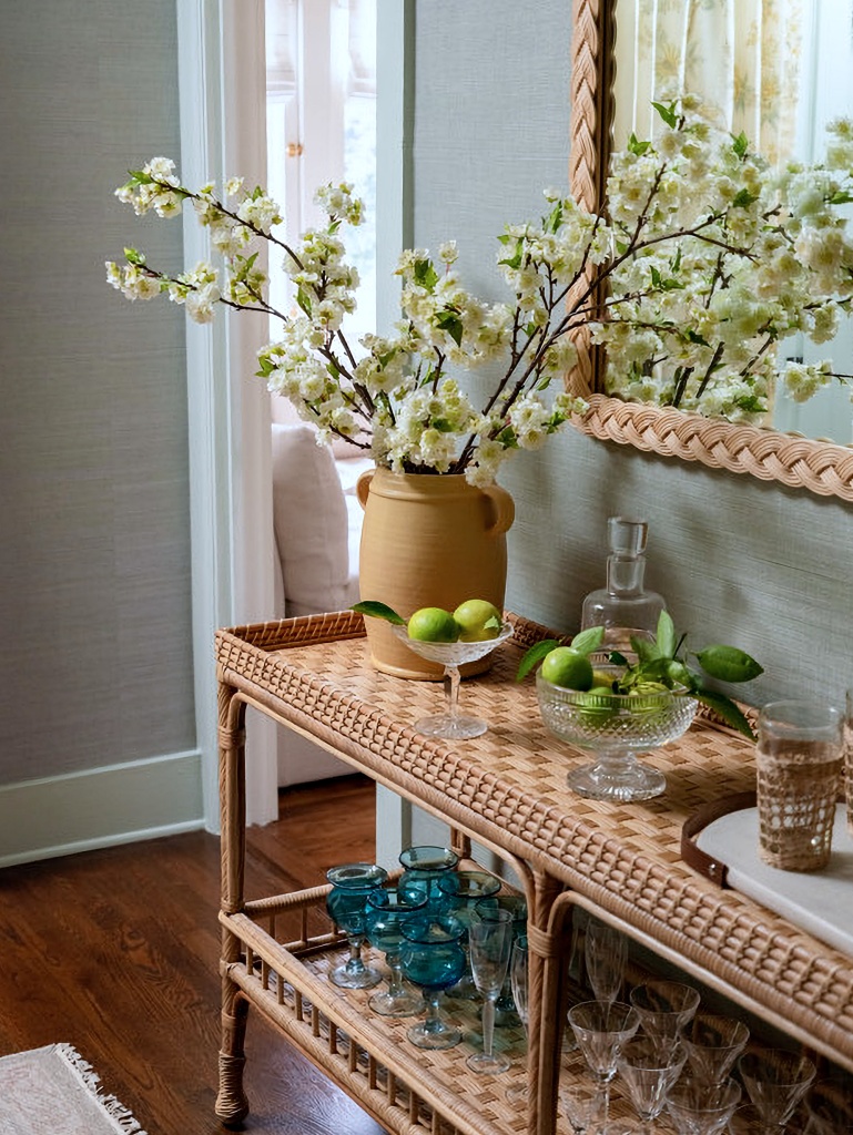 wicker bar cart in sage green dining room