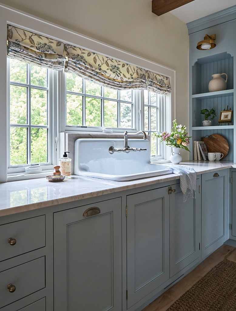 farmhouse sink in pale blue kitchen