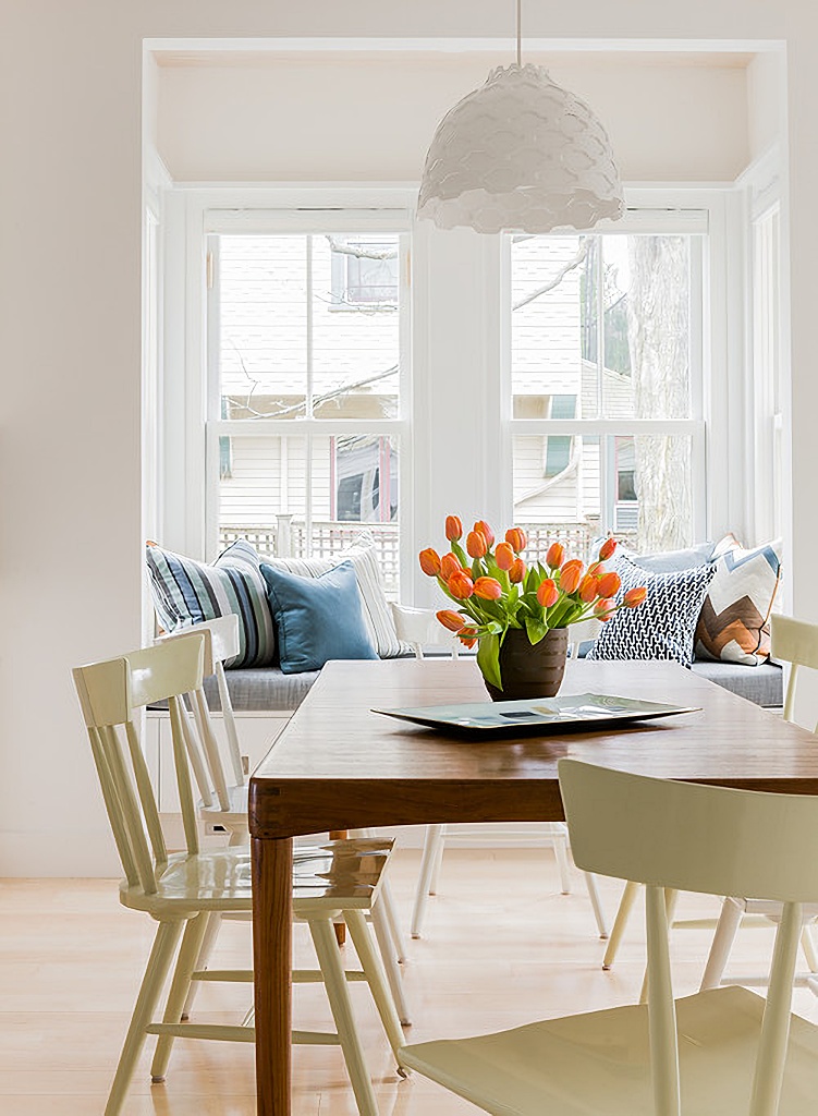 orange tulips in a breakfast nook