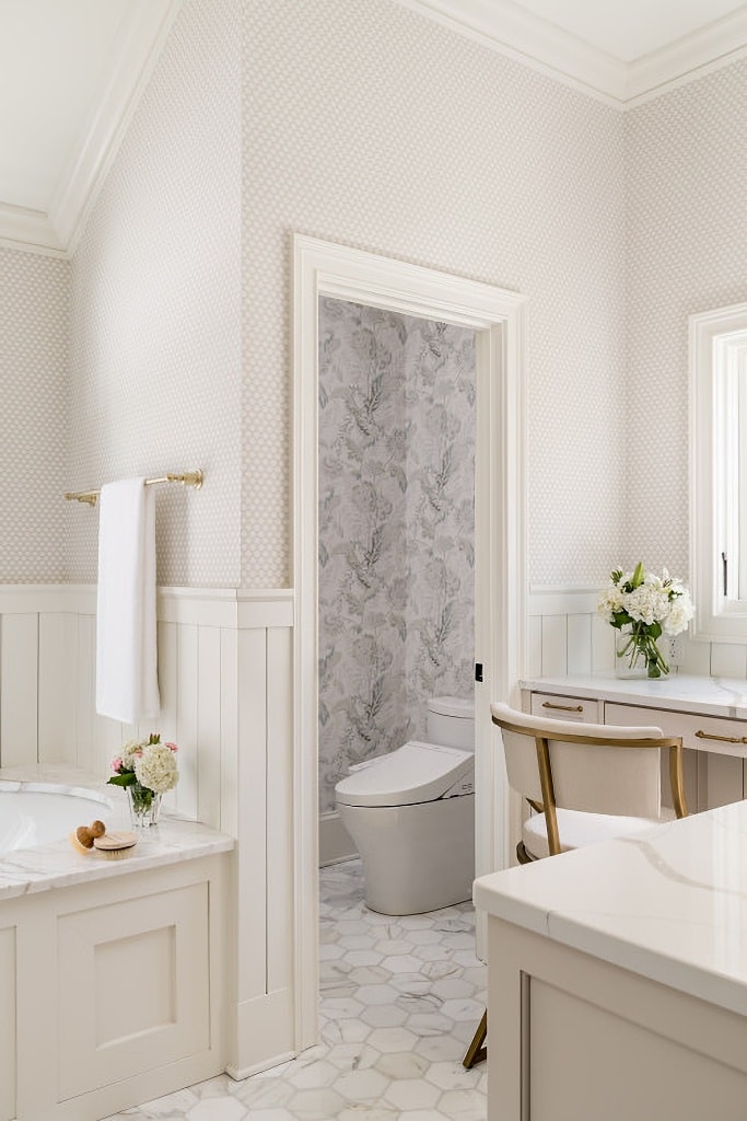 neutral bathroom with wallpaper and tile