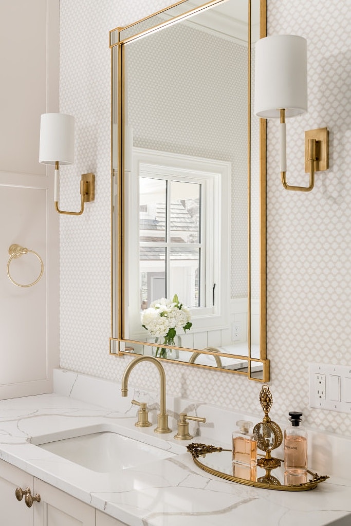 gold fixtures in traditional bathroom