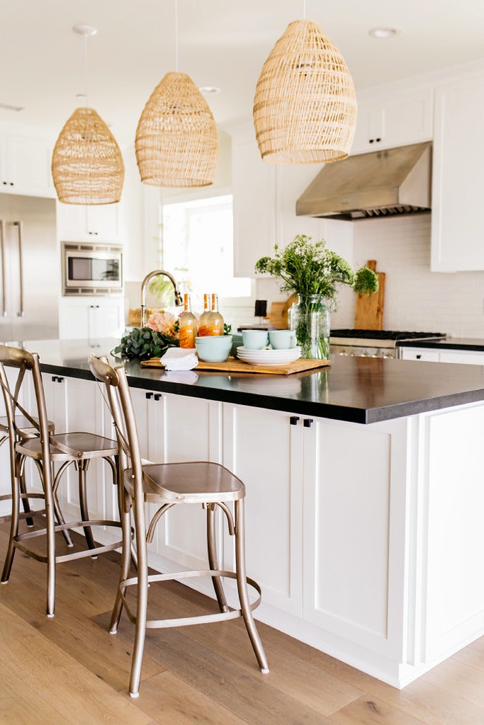 modern farmhouse kitchen with three pendant lights above island