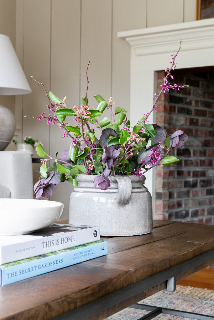 flower arrangement in stone crock