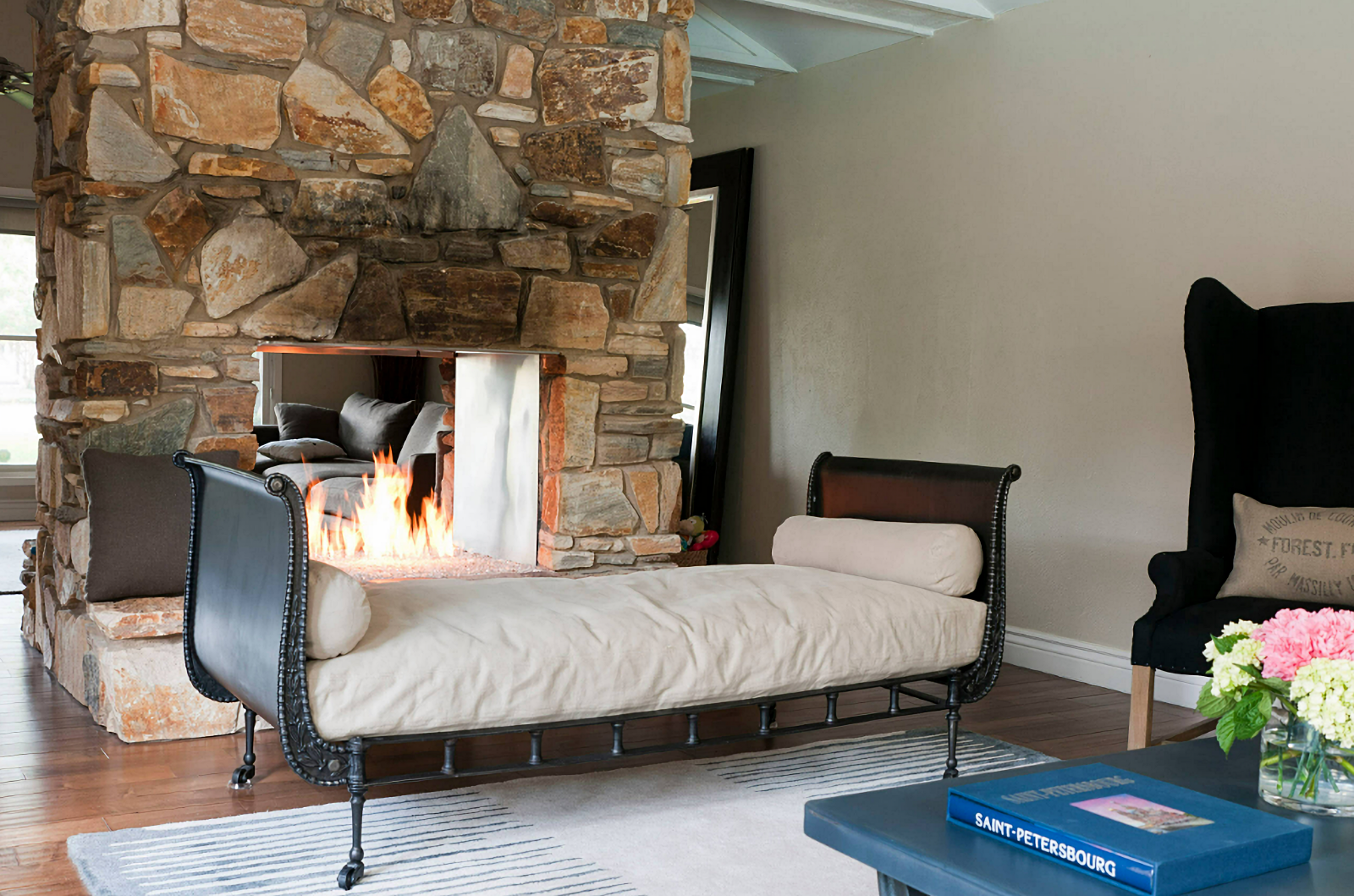 rustic living room with stone fireplace