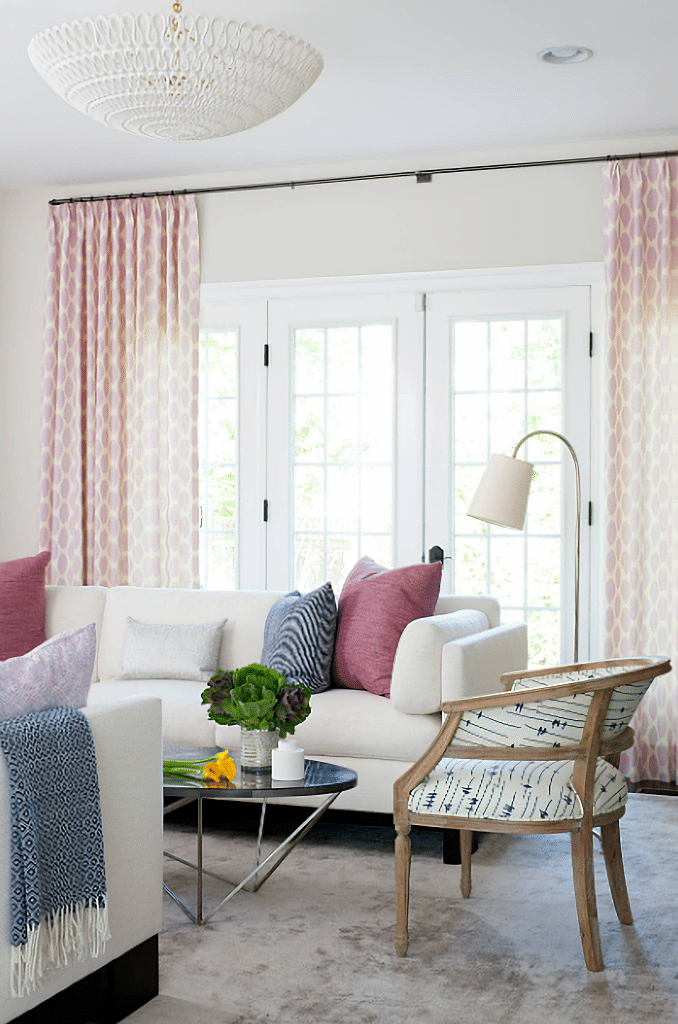 modern living room in pink, white, and blue