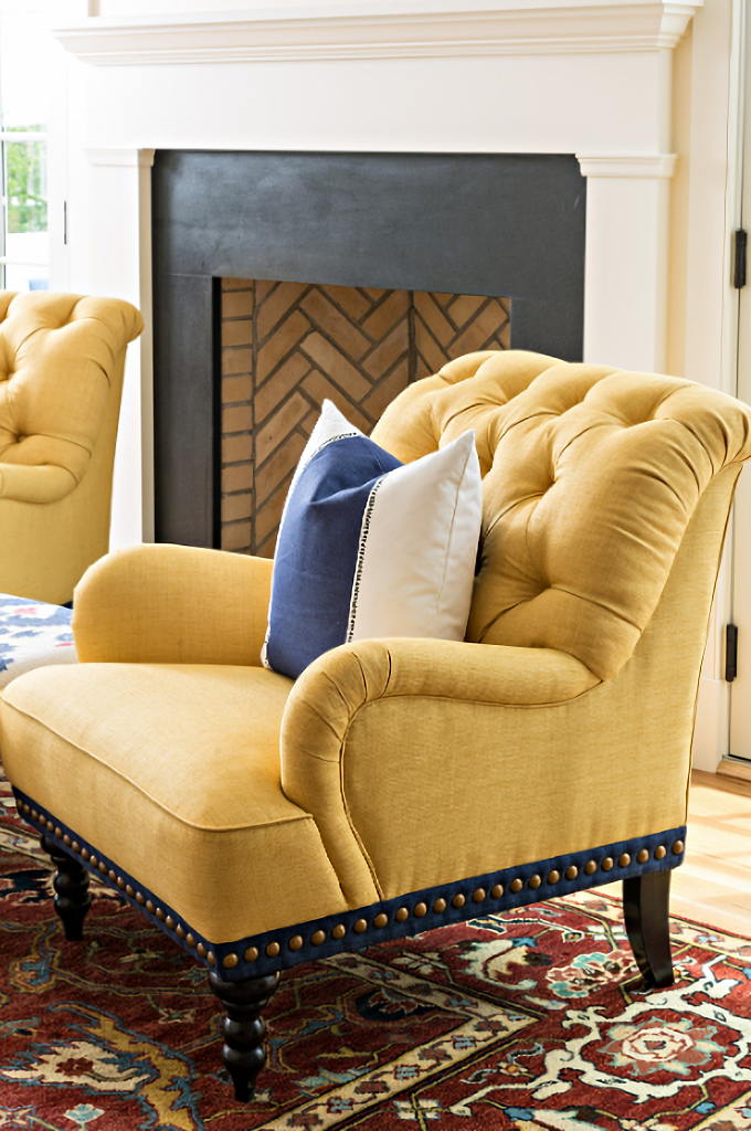 yellow tufted chair