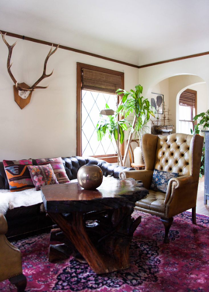 earthy living room with leather, tufted furniture